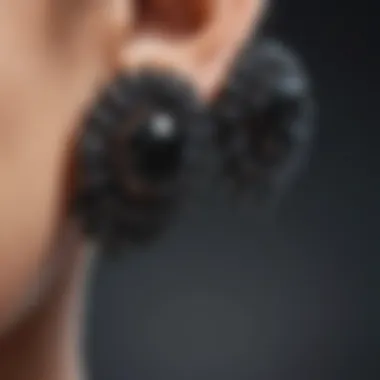Diverse Designs of Zirconia Studs Various styles of black cubic zirconia stud earrings arranged artistically.