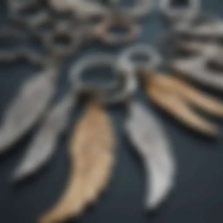 Close-up of various angel wing key chains highlighting different materials